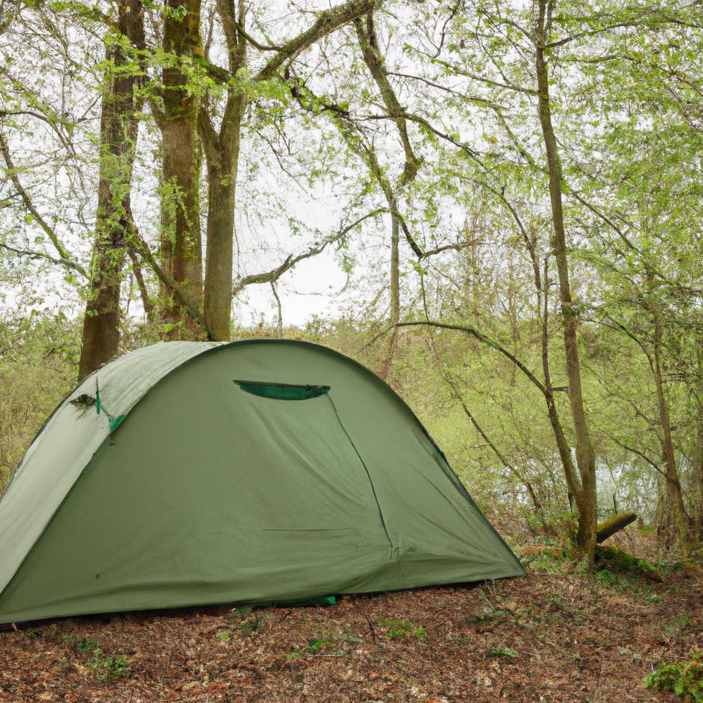 A cozy campsite with a tent pitched beneath tall trees. A campfire burns nearby, casting a warm glow on the surrounding area. The sun sets in the background, painting the sky in shades of pink and orange.