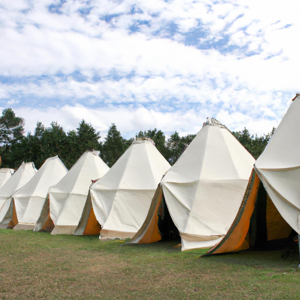 A peaceful campsite nestled among towering trees with a glowing campfire and tents under the starry sky. A babbling stream winds through the site, providing a tranquil soundtrack to the crackling fire and chirping crickets.