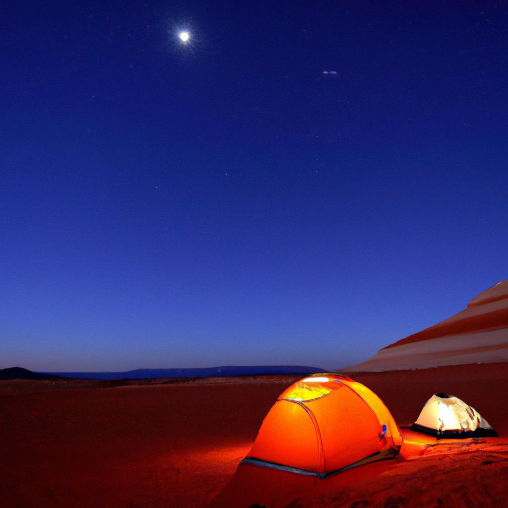 A serene campsite nestled among tall trees with a cozy tent pitched nearby. Smoke rises from a crackling campfire as the sun sets behind a mountain ridge. The sound of chirping crickets and rustling leaves fills the cool evening air.